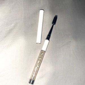 Brand new UNUSED eyelash/eyebrow brush. Portable and durable with sparkle+shine!